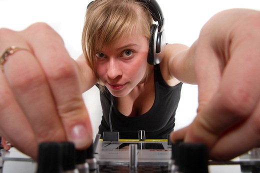 Teenage girl DJ adjusting sound levels Teenage girl DJ adjusting sound levels