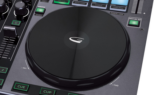 The jogwheels are large and weighted, with a mechanical top plate in the style of the Traktor Kontrol S4.